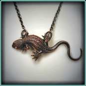 Shibuichi
  Roughskin Newt Pendant. Shibuichi & Sterling Silver; Patinaed. Newt pendant is also available in Sterling Silver.